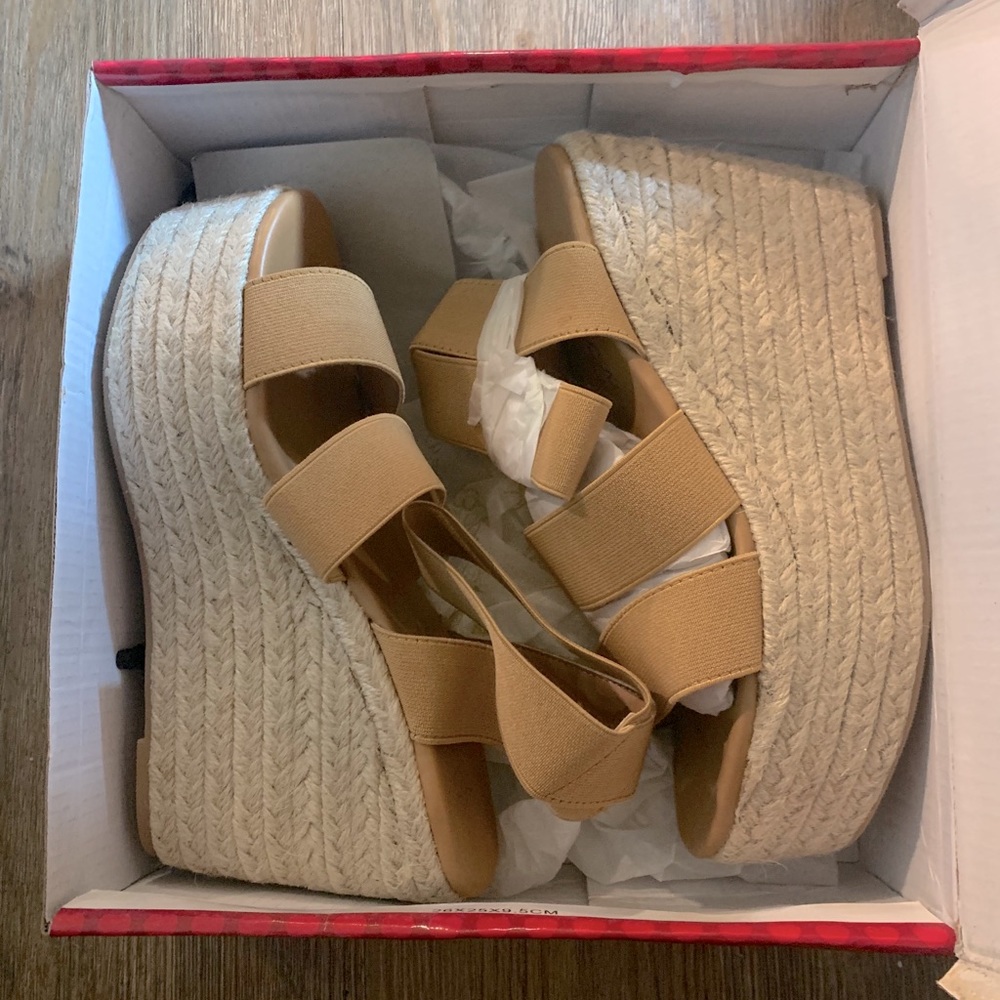 Never worn woven heeled wedges!